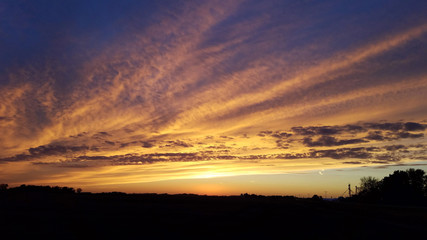 Sunset over an open field