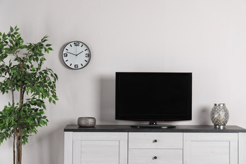 Modern TV set in living room interior