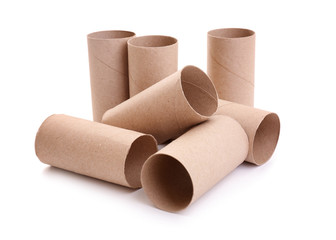 Empty paper toilet rolls on white background