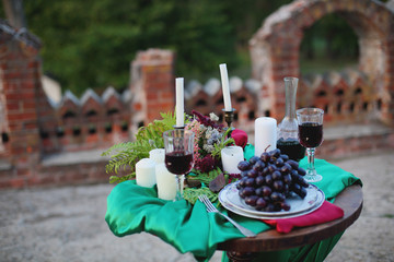 table setting for wedding, decorations green and Burgundy.