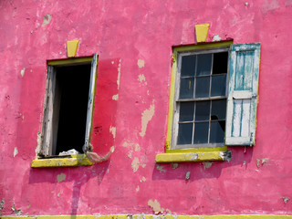 Peeling pink paint on a run down building in Nassau, Bahamas