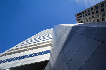 Obraz premium Corner of a skyscraper of Montreal, Canada, taken in the center business district of the main city of Quebec, a symbol of the Canadian economy