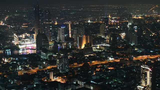 4K Time lapse of aerial view of view of Bangkok cityscape car and boat traffic at night