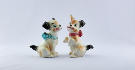 Fototapeta na wymiar Ceramic happy puppy dog salt and pepper shaker set