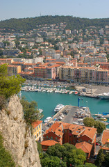 Fototapeta na wymiar Sailboats, Boats, and Homes on a harbor in Nice, France