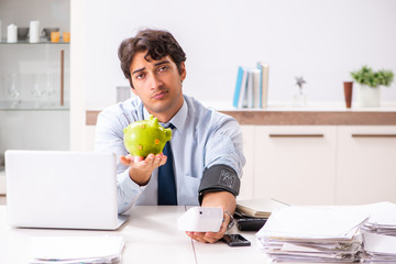 Fototapeta premium Man under stress measuring his blood pressure