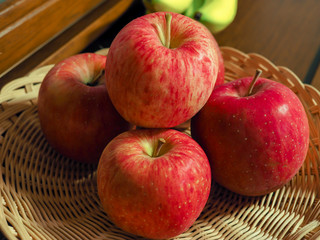 Stack of apple and basket.