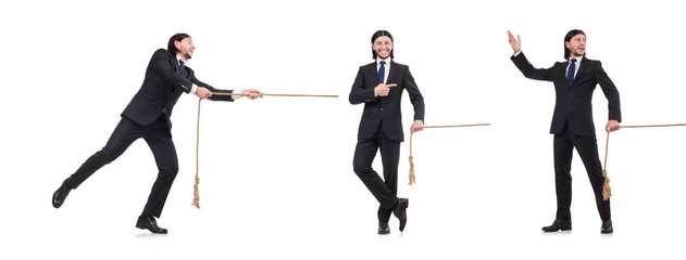 Young businessman pulling rope isolated on white