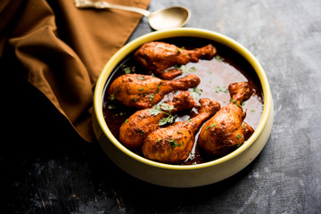 Chicken leg / drumstick curry or Murg Tangri/tangdi masala. Served in a bowl over moody background. Selective focus