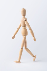 walk wooden mannequin isolated on white background