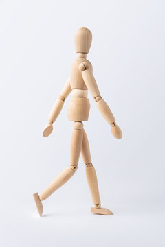 walk wooden mannequin isolated on white background