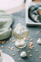 Coffee with mint on a wooden table. Food styling and desserts with flowers.