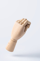  wooden raise hand with fist posture isolated on white