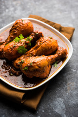 Chicken leg / drumstick curry or Murg Tangri/tangdi masala. Served in a bowl over moody background. Selective focus