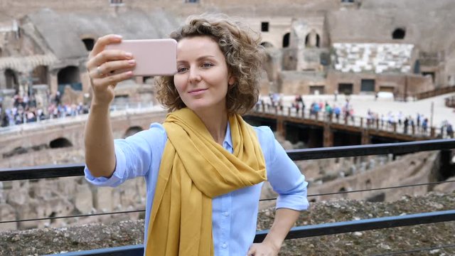Young Traveler Woman Taking Selfie Using Smartphone At Famous Tourist Attraction.