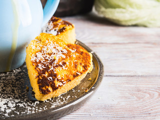 Pumpkin coconut flour heart shaped fritters for healthy breakfast served with lemon curd