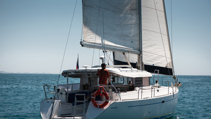 Fototapeta premium White yacht sailing in the open sea