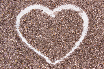 Heart shaped chia seeds, concept of food containing natural vitamins, fiber and minerals