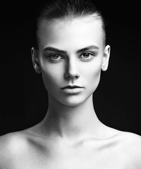 Fototapeta premium Beautiful woman face close up studio on black background