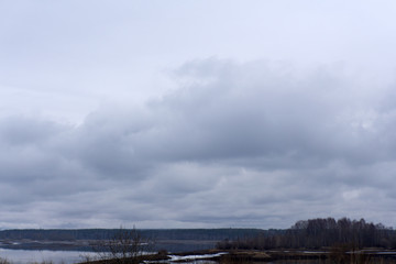 Dark clouds and beautiful colors over the island .