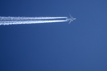 An airplane trail across the sky journey smoke,