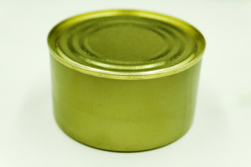 Close up of tin cans arranged on a dark wood background .