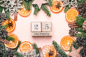 Christmas natural frame of Dry Oranges Slices and decor. Calendar December 25. Vintage toning.
