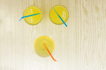 Mango smoothies, juice and fruit mango yellow on white wood from the top view.