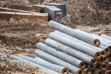 Open construction work site with heavy machinery equipment construction materials 