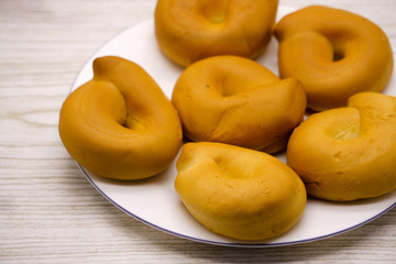 Fresh bread bagel with poppy seed on sackcloth. Russian traditional bakery product. or bakery pastry banner, ad, poster.