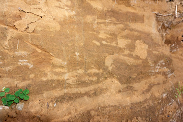 Close-up background image, cut section, gravel layer and mud under the concrete road, which was excavated to embed the pipe.