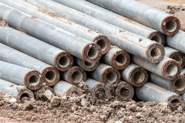 Open construction work site with heavy machinery equipment construction materials 