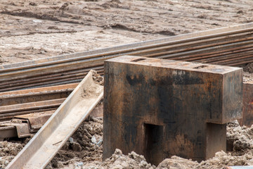 Open construction work site with heavy machinery equipment construction materials 
