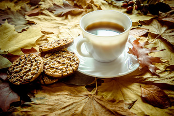 Autumn still life with cup of black coffee 