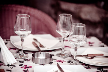 Tables in a cafe on the street of the ancient city 