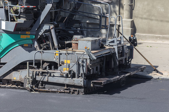 machine for laying asphalt closeup