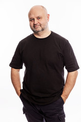 Fototapeta premium Adult bald man is standing, portrait on white background