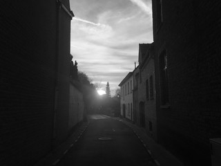 Sunrise on small street in village black and white tone