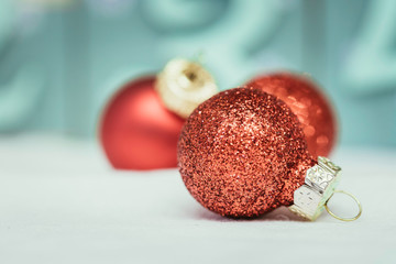 Red Christmas balls with decoration on shiny background