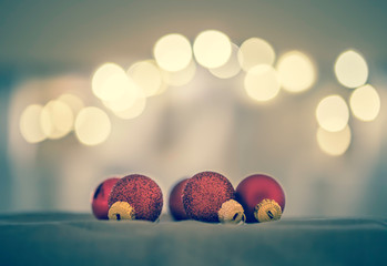 Red Christmas balls with decoration on shiny background