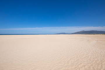 Fototapeta na wymiar landscape of beautiful sandy big and lonely beach Los Lances, in Tarifa, Cadiz, Andalusia, Spain