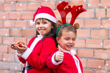 portrait of children dressed as Santa Claus