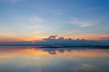 Beautiful sunset reflected in the lake in thailand.