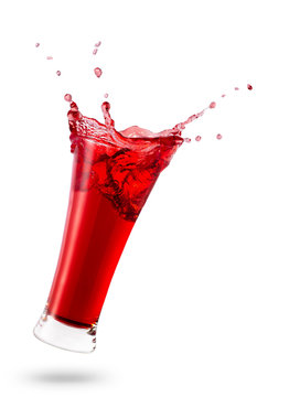 falling glass with red juice