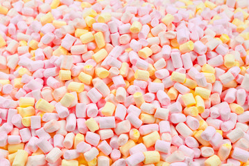 Marshmallow. Background of pink and yellow colorful mini marshmallows.