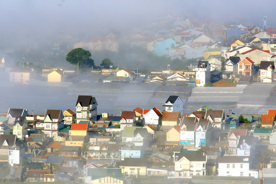 Part of Dalat city in Central highland of Vietnam on morning mist