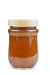 Homemade gooseberry jam in glass jar isolated on white background