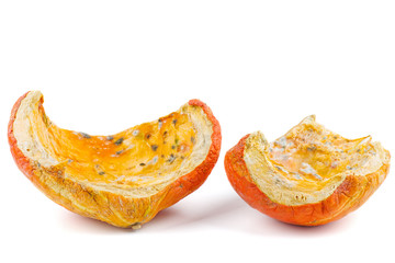 Rotten pumpkin pieces isolated on white background