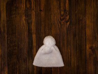 Christmas background. White hat with wood copy space. Flat lay New year minimal.