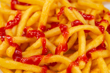 French fries with ketchup served on white plate